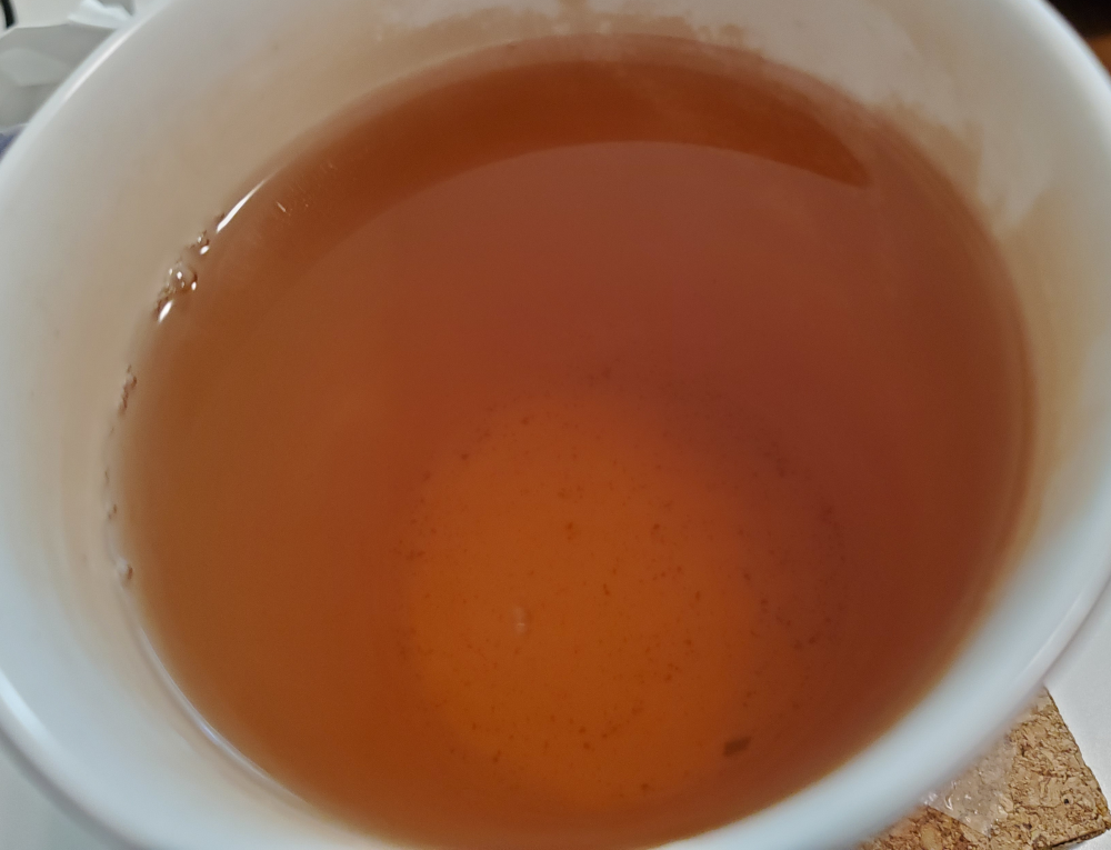 a cup of hot puerh sheng